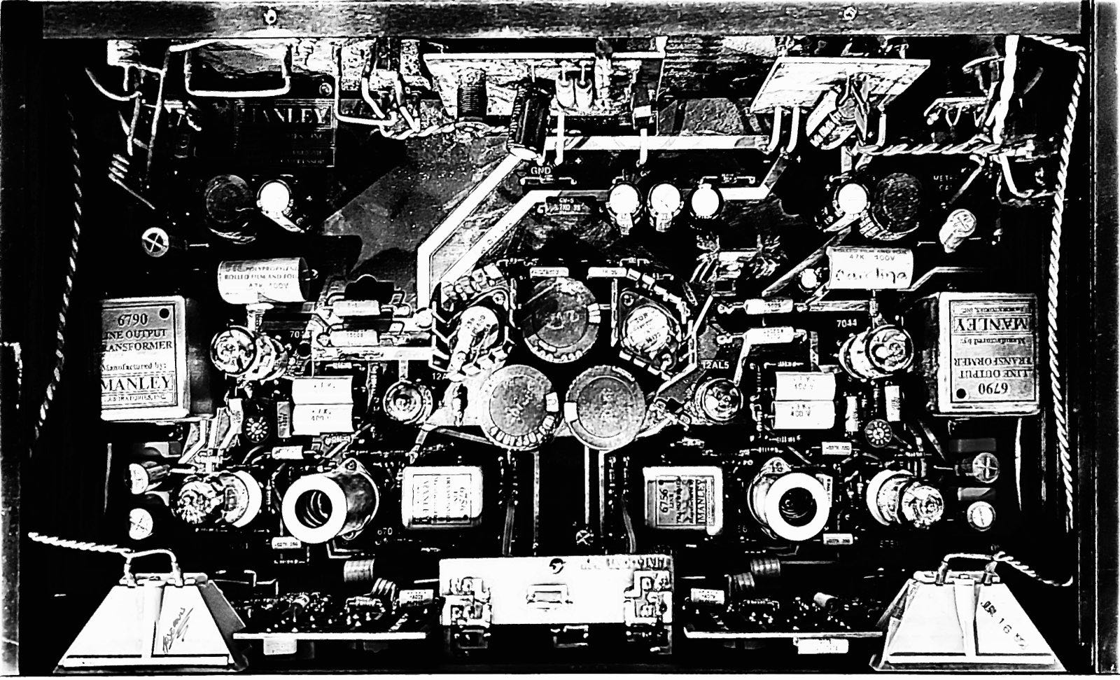Inside a Manley Variable Mu tube compressor — the full chassis from above: output transformers, valve sockets, film capacitors and hand-wired point-to-point signal path.